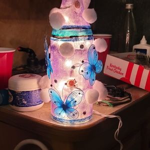 Hand painted light up bottles and decorated by hand